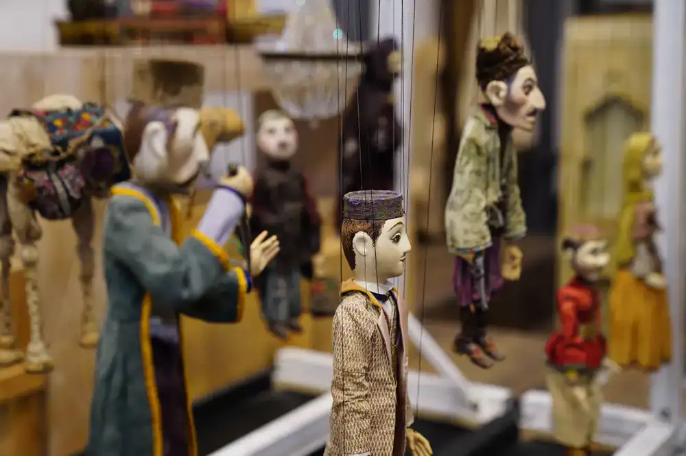 Close up of a handcrafted wooden marionette