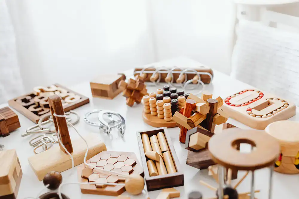 A collection of handcrafted wooden toys on a workshop table